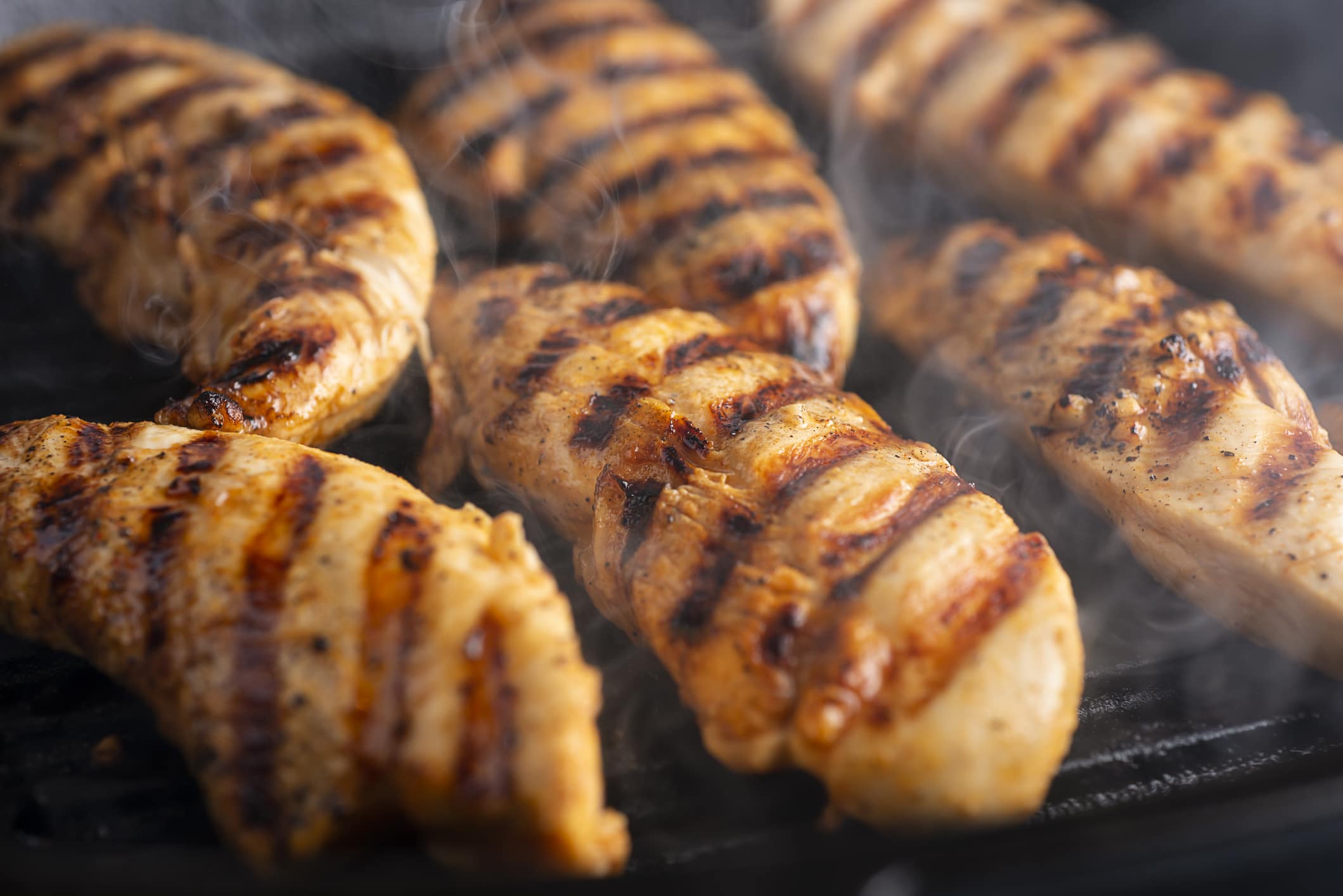 Close-up of chicken tenders being grilled