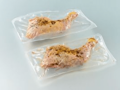 Seasoned cryovac whole leg pieces of chicken